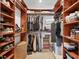 Large walk-in closet with shelving and hanging space at 10311 Lands End Cir # 13, Placida, FL 33946