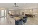 Open concept living room, kitchen and dining area with wood flooring at 12424 Davie Ct, Venice, FL 34293