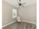 Office with ceiling fan, hardwood floors, and a comfortable recliner at 12424 Davie Ct, Venice, FL 34293
