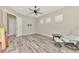 Spacious office with hardwood floors, ceiling fan, and access to patio at 12424 Davie Ct, Venice, FL 34293