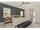 Main bedroom with a sitting area and ensuite bathroom access at 12424 Davie Ct, Venice, FL 34293
