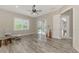 Bright office with hardwood floors, a ceiling fan, and sliding glass doors at 12424 Davie Ct, Venice, FL 34293