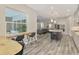 Open concept kitchen with island and stainless steel appliances at 12424 Davie Ct, Venice, FL 34293