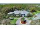 Aerial view of community clubhouse with pool and landscaping at 12424 Davie Ct, Venice, FL 34293