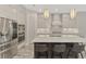 Spacious kitchen boasts stainless steel appliances and a large marble island at 12424 Davie Ct, Venice, FL 34293