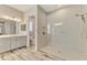 Bathroom with walk in shower and single vanity at 12424 Davie Ct, Venice, FL 34293