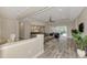 Open living room showcasing a large sectional sofa and access to backyard patio at 12424 Davie Ct, Venice, FL 34293