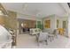 Covered patio with outdoor kitchen, seating, and pool view at 12424 Davie Ct, Venice, FL 34293