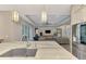 Modern kitchen with marble countertops, stainless steel appliances, and an open layout at 12424 Davie Ct, Venice, FL 34293