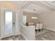 Bright entryway with glass front door and view into spacious dining area at 12424 Davie Ct, Venice, FL 34293
