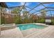 Enclosed pool and spa with screened patio at 12424 Davie Ct, Venice, FL 34293
