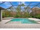 Luxury screened-in pool and spa with spacious patio area at 12424 Davie Ct, Venice, FL 34293