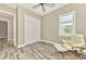 Office with ceiling fan, hardwood floors, and a comfortable recliner at 12424 Davie Ct, Venice, FL 34293