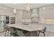 Modern kitchen with gray cabinets, marble countertops, and stainless steel appliances at 12424 Davie Ct, Venice, FL 34293