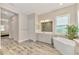 Spa-like bathroom with soaking tub and walk-in shower at 12424 Davie Ct, Venice, FL 34293
