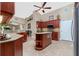Well-equipped kitchen with ample cabinetry, granite countertops, and an island at 15658 Stuart Cir, Port Charlotte, FL 33981