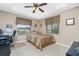 Bright bedroom with double bed, window, and ceiling fan at 15658 Stuart Cir, Port Charlotte, FL 33981