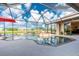 Relaxing screened pool and spa with open-air enclosure at 15658 Stuart Cir, Port Charlotte, FL 33981