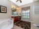 Elegant bathroom with double vanity, soaking tub, and separate shower at 15658 Stuart Cir, Port Charlotte, FL 33981