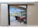 Relaxing view of the pool and lanai from the Primary bedroom at 15658 Stuart Cir, Port Charlotte, FL 33981