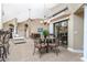 Breakfast nook with a small table and chairs, offering a view into the living room and kitchen at 15658 Stuart Cir, Port Charlotte, FL 33981