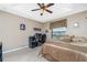 Spacious bedroom with a workspace and large bed at 15658 Stuart Cir, Port Charlotte, FL 33981