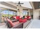 Enclosed patio with pool access and comfortable wicker furniture at 15658 Stuart Cir, Port Charlotte, FL 33981