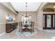 Formal dining room with a round table and chandelier at 15658 Stuart Cir, Port Charlotte, FL 33981