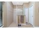 Large walk-in shower with glass enclosure and neutral tile at 15658 Stuart Cir, Port Charlotte, FL 33981