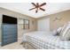 Main bedroom with dresser, large bed, and ceiling fan at 15658 Stuart Cir, Port Charlotte, FL 33981