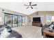 Relaxing Gathering room with sliding doors opening to a pool and lanai view at 15658 Stuart Cir, Port Charlotte, FL 33981