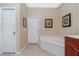 Bathroom with a large soaking tub and tile flooring at 15658 Stuart Cir, Port Charlotte, FL 33981