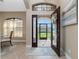 Bright and airy entryway with a view to the backyard at 15658 Stuart Cir, Port Charlotte, FL 33981
