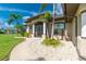 House exterior featuring a welcoming walkway and landscaping at 15658 Stuart Cir, Port Charlotte, FL 33981