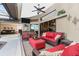 Bright enclosed patio features wicker furniture and a view of the pool at 15658 Stuart Cir, Port Charlotte, FL 33981