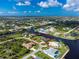 Single-Gathering home on a canal with a large backyard and dock at 15658 Stuart Cir, Port Charlotte, FL 33981