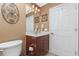 Small bathroom with toilet, sink and vanity at 15658 Stuart Cir, Port Charlotte, FL 33981
