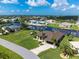 Single-Gathering home located on a canal with lush landscaping at 15658 Stuart Cir, Port Charlotte, FL 33981