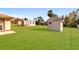 Large backyard with two sheds and lush green grass at 10075 Stonecrop Ave, Englewood, FL 34224