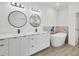 Bathroom with double vanity, soaking tub, and walk-in shower at 308 Capatola St, Port Charlotte, FL 33948
