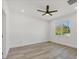 Bedroom with ceiling fan and wood-look flooring at 308 Capatola St, Port Charlotte, FL 33948