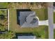 Aerial view of house, driveway and surrounding neighborhood at 308 Capatola St, Port Charlotte, FL 33948