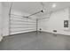Spacious garage with an automatic garage door and epoxy flooring at 308 Capatola St, Port Charlotte, FL 33948