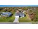 Aerial view of a single story house in a residential neighborhood at 308 Capatola St, Port Charlotte, FL 33948