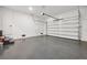 Spacious two-car garage with epoxy flooring and automatic opener at 308 Capatola St, Port Charlotte, FL 33948