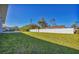 Spacious backyard with grassy area and privacy fence at 308 Capatola St, Port Charlotte, FL 33948