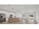 Modern kitchen with stainless steel appliances and light wood island at 308 Capatola St, Port Charlotte, FL 33948