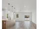 Modern kitchen with island, stainless steel appliances, and light wood cabinets at 308 Capatola St, Port Charlotte, FL 33948