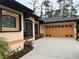 One-story home with orange garage door at 5160 Farewell St, Port Charlotte, FL 33981