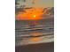 Stunning sunrise over the ocean with a beautiful sandy beach at 6297 Lori Ter, Port Charlotte, FL 33981